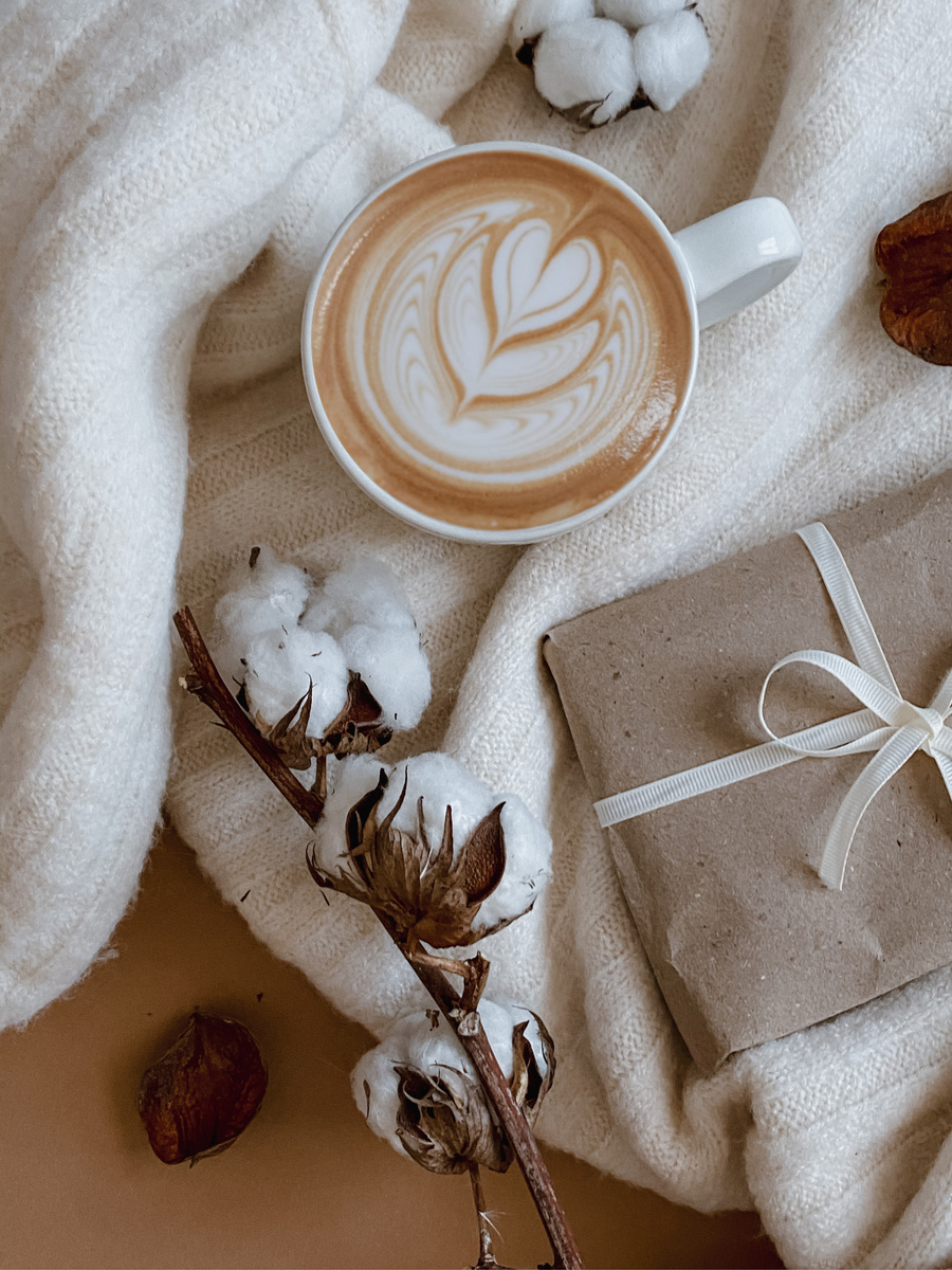 White Ceramic Mug With Coffee on a White Cloth